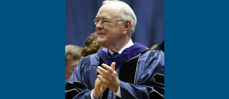 Charles T. Manatt claps in regalia at commencement 