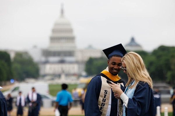 Graduates share a moment on the National Mall