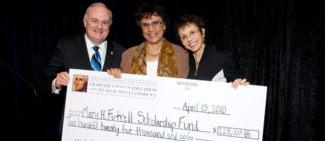 Steven Knapp and Mary Futrell with oversized check for her scholarship fund