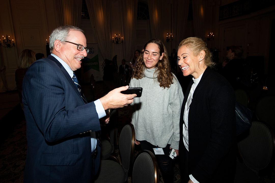  President LeBlanc shares a photo with newly admitted student Ella Haines and her mother Jamie (Wool) Haines, B.A. ‘96