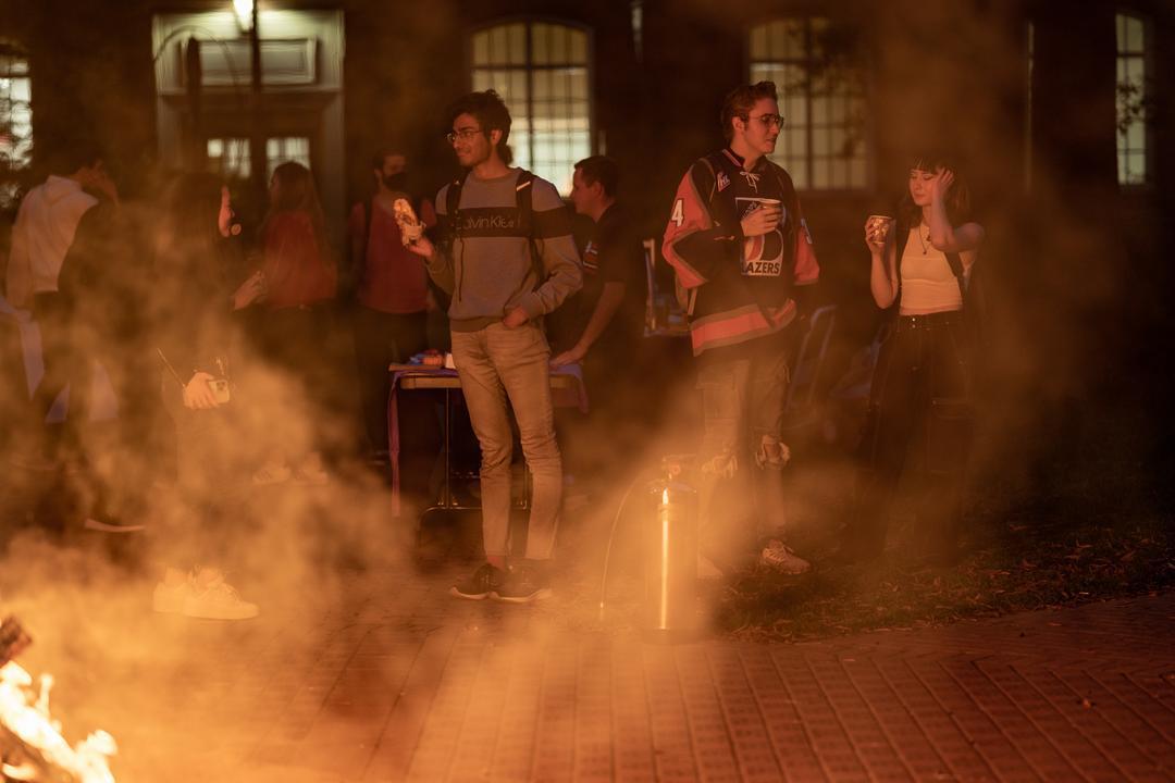 Students socializing at bonfire