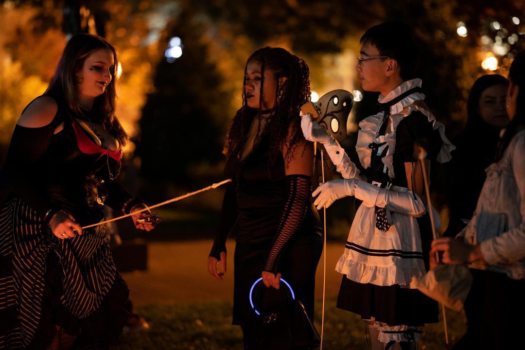 Students in costume at bonfire