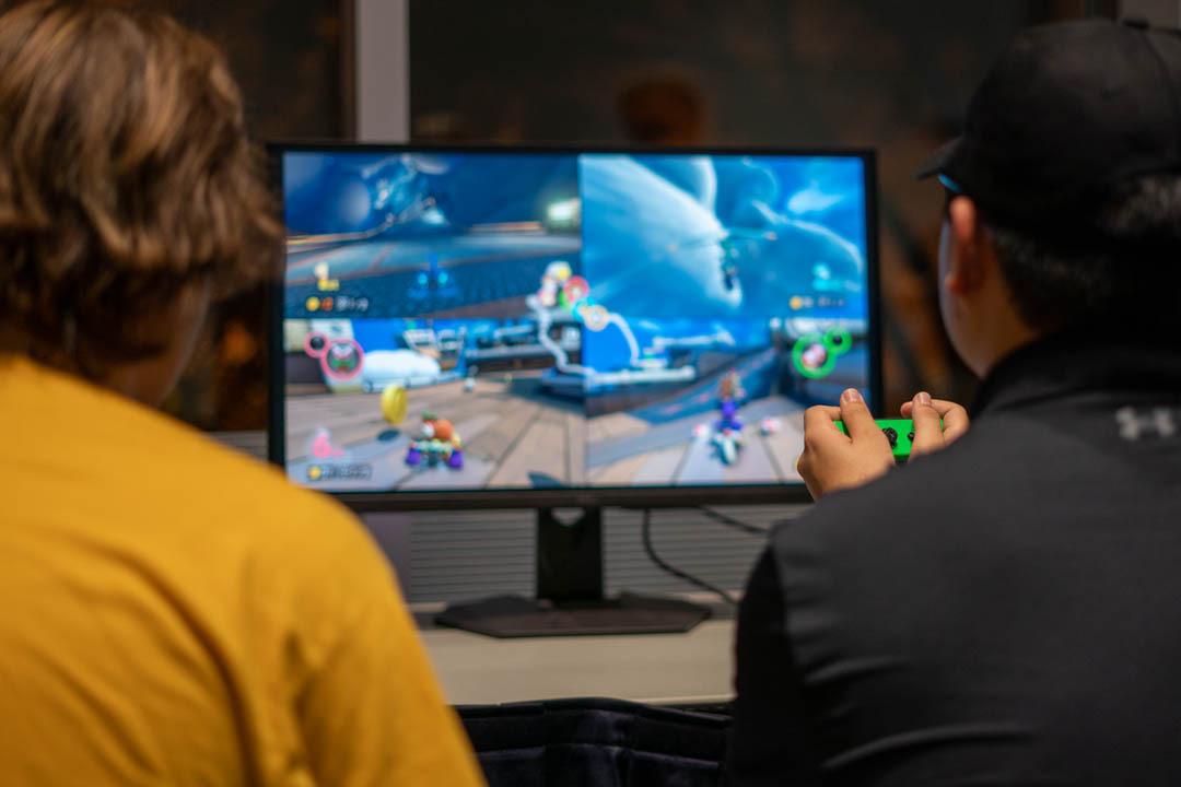 Students playing video games at boo bash