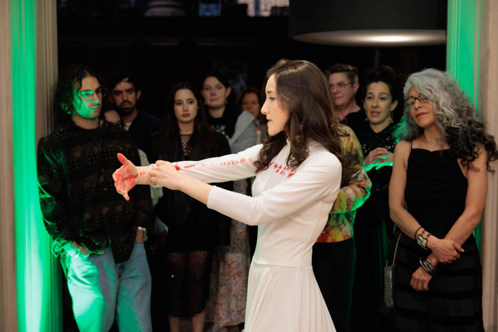 Spectators watch woman perform at NEXT