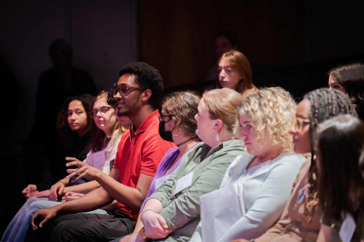 First-year student Nathan Desta (red shirt) poses a question to Kerry Washington. 