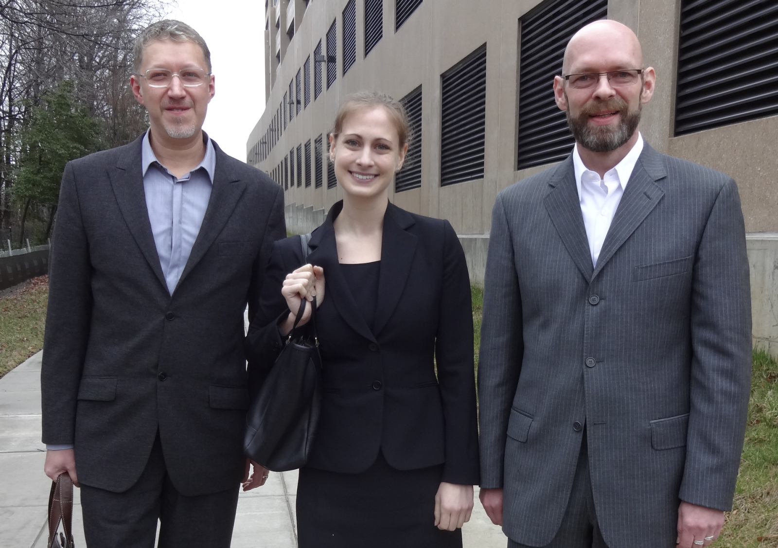 Sydney Josephson, J.D. '14, is flanked by Alexander Love and Michael Love in April 2014 on the day of their interview in support of their marriage-based immigrant petition, which was approved soon after. 