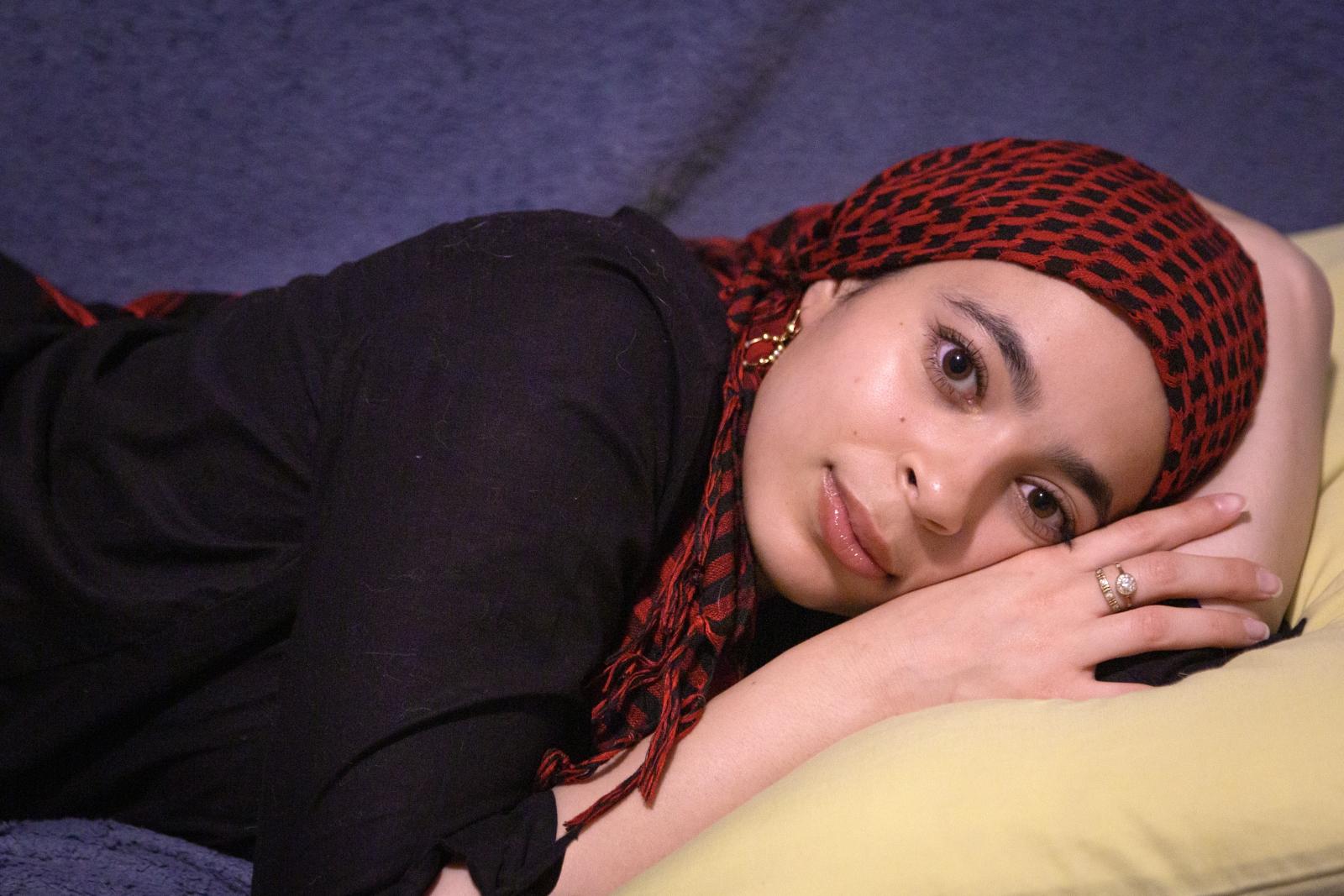 Sawsan Selim on a futon; photo by Chasity Smith
