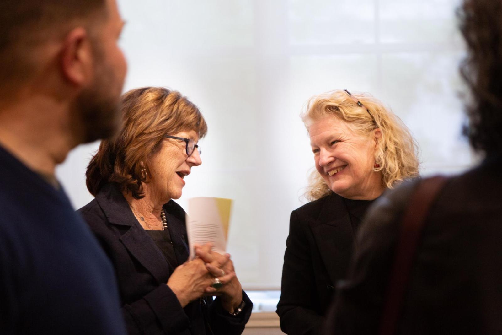 Lauren Onkey, director of the Corcoran School, chats at the party