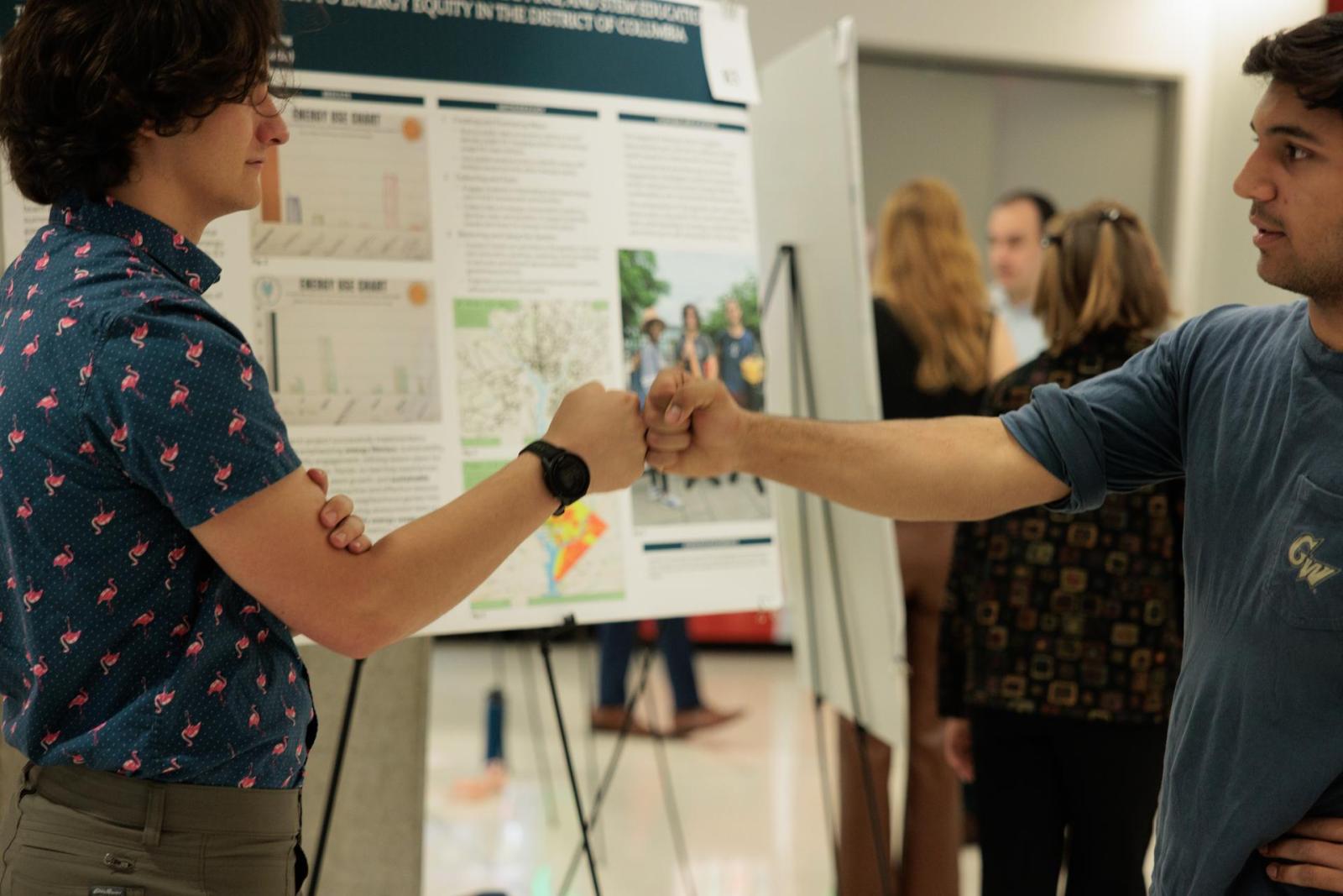 Eliot Hunter, left, worked on energy literacy with students in Anacostia. (William Atkins/GW Today)