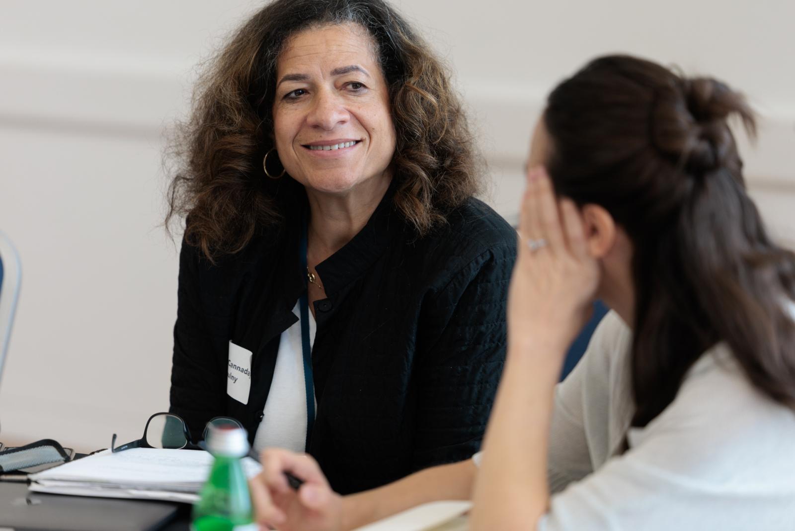 Two particpants practice dialogic techniques at Teaching Day.