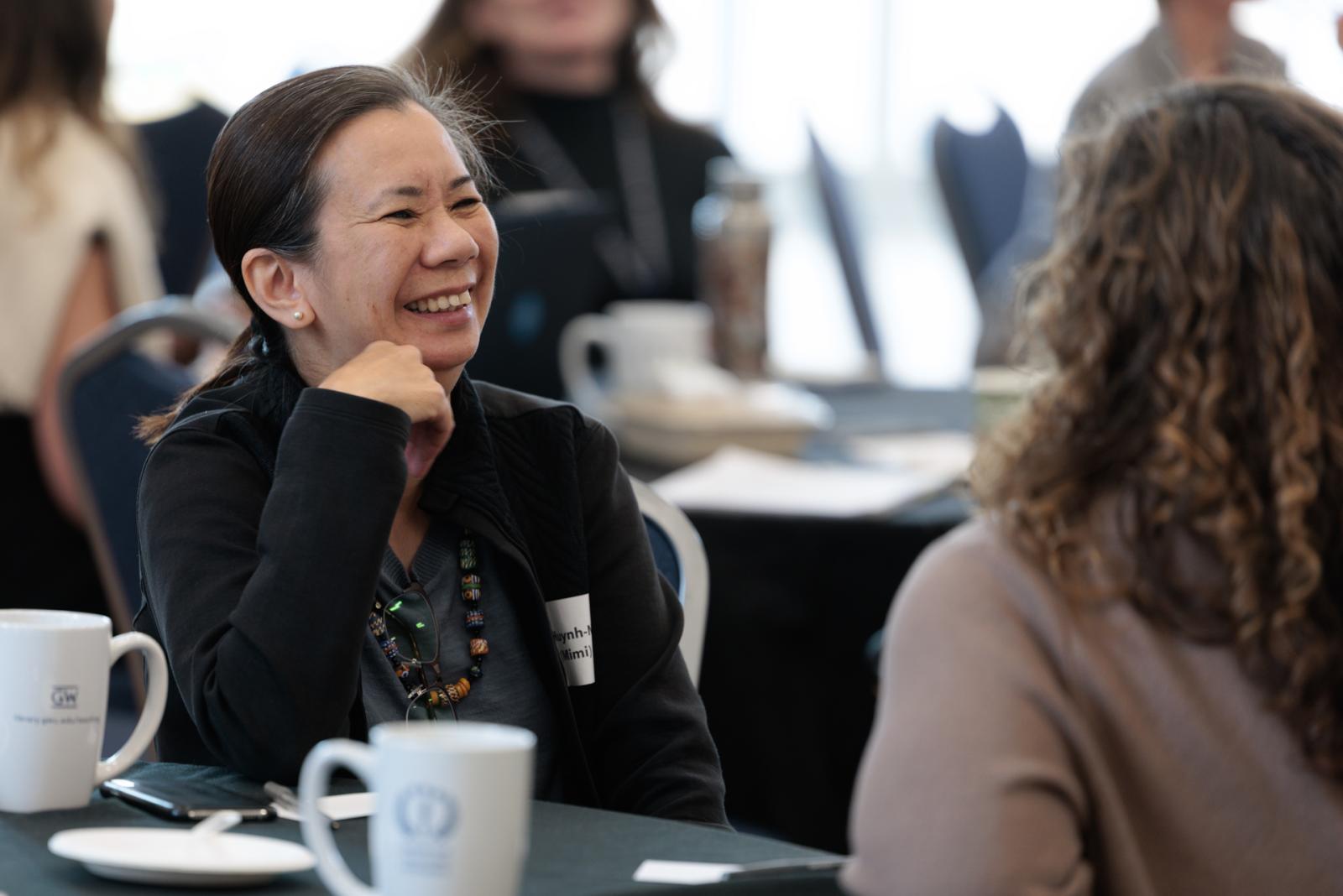 Two women learn how to foster dialogue at Teaching Day
