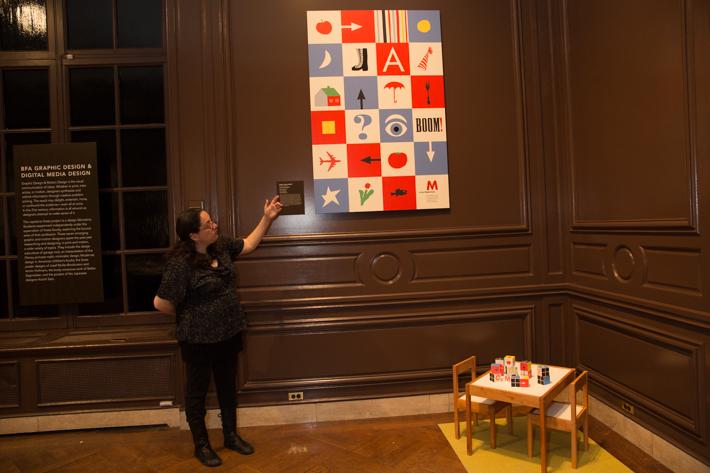Senior Sara Sklaroff, points to her NEXT Exhibition, "Blocks for Young Modernity."