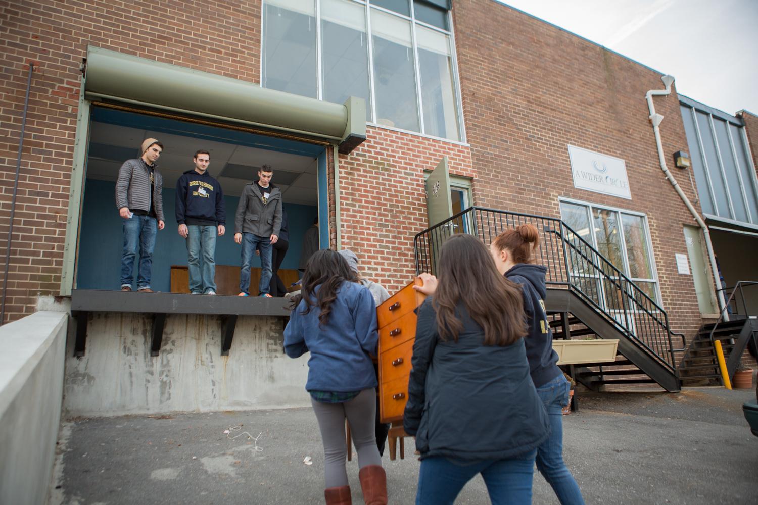GW students helped organize and move furniture at A Wider Circle in Silver Spring, Maryland. 