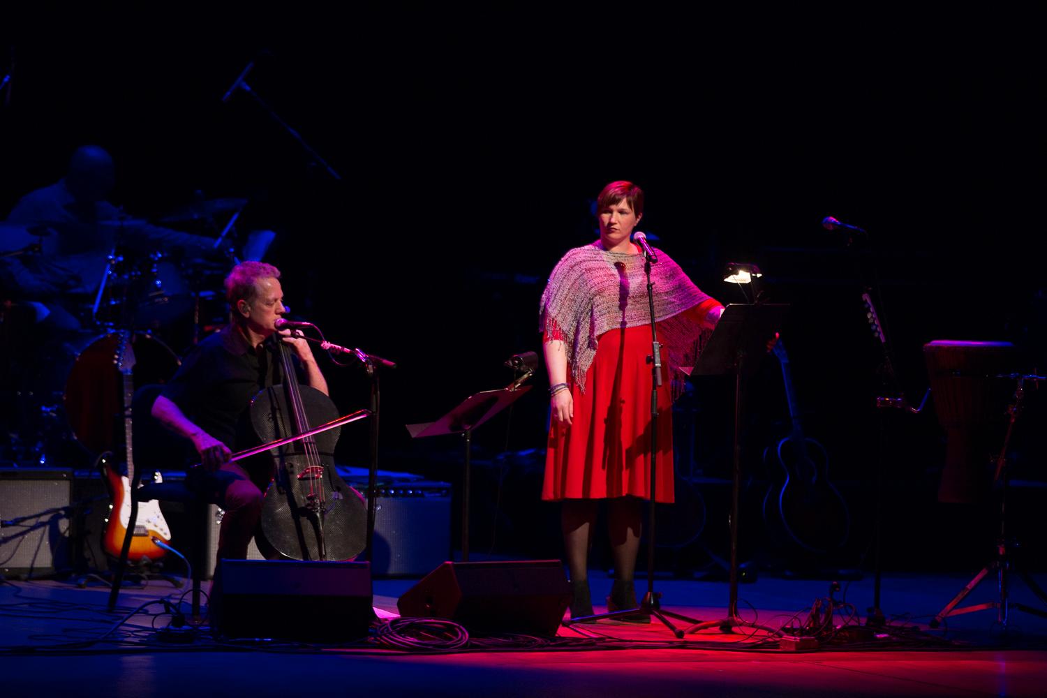 Poet and veteran Jenny Pacanowski reads one of her pieces to Michael Bacon's music.