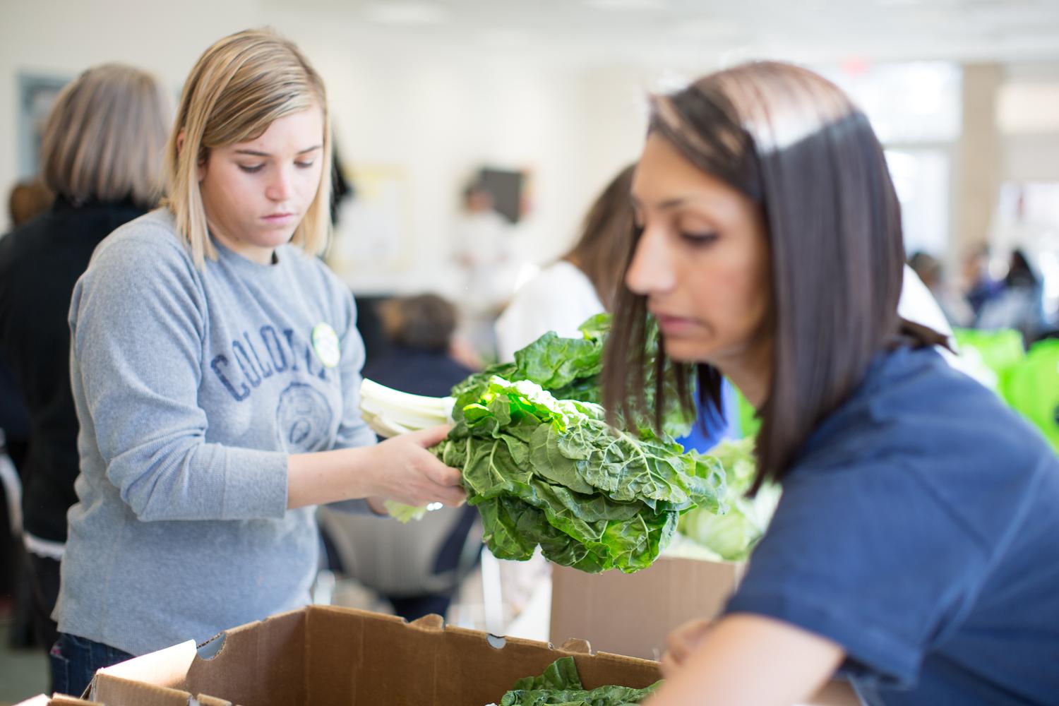 Students and staff representing GW filled bags with produce at the Pop-Up Market.