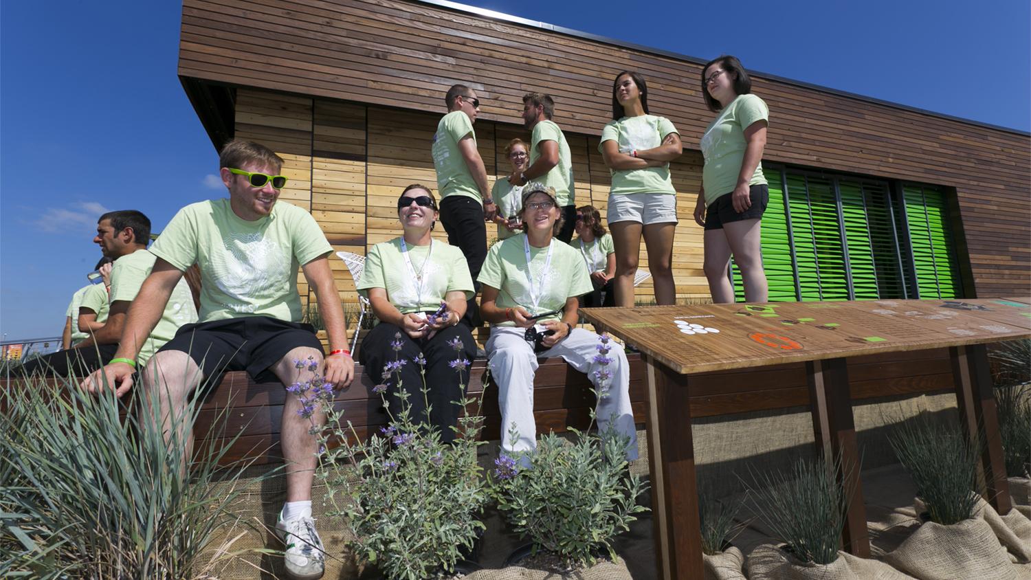 Team Capitol DC sits in front of Harvest Home 