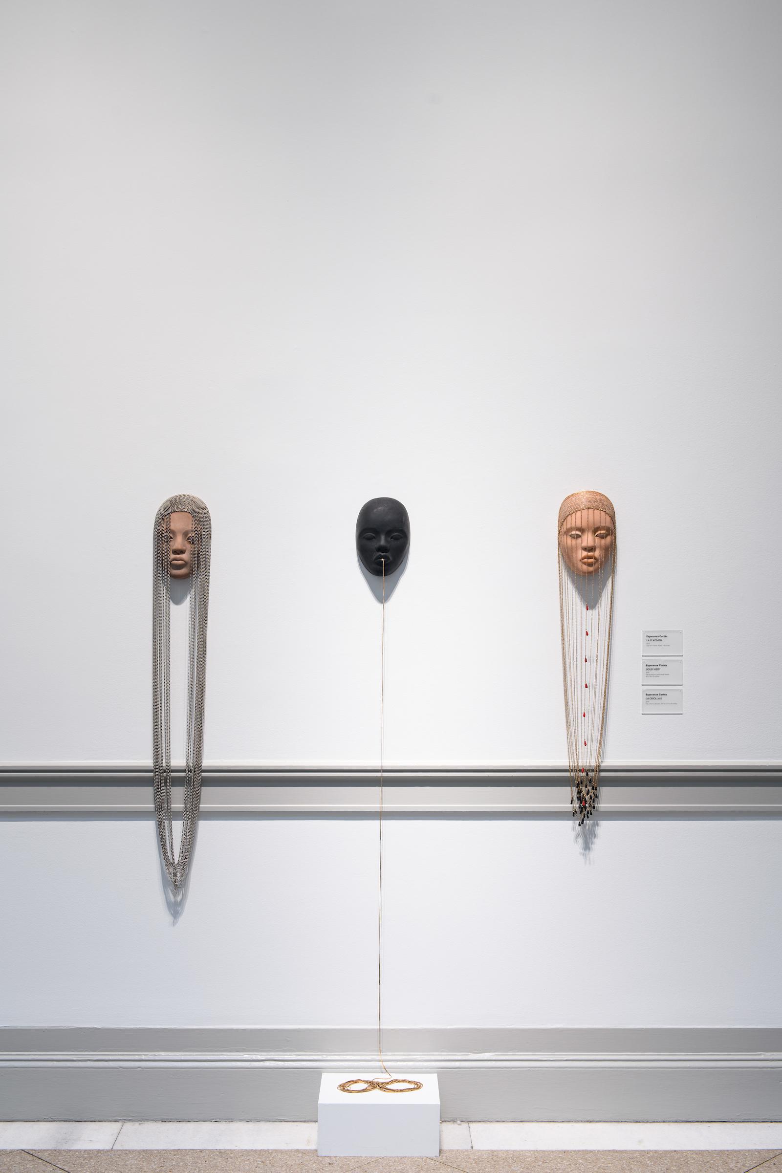 Esperanza Cortes - LA PLATEADA, 2019, clay and chains, 48 x 6 x 4 inches. GOLD VIEW, 2019, clay sculpture, gold metal beads, 60 