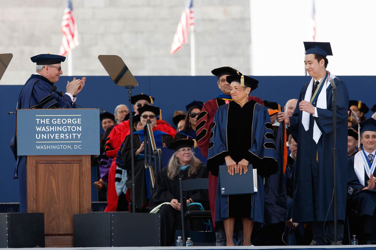 President LeBlanc at podium clapping for award recipients