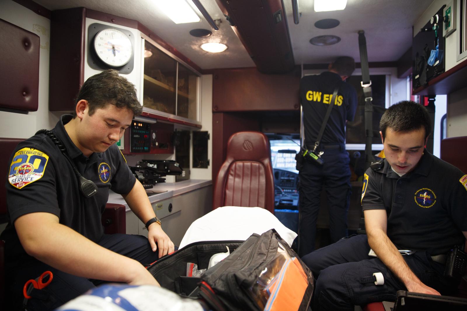 students scan interior of ambulance to check supplies