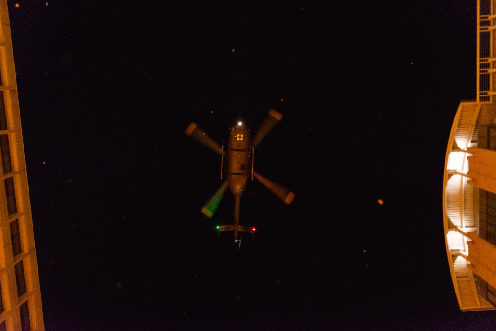Image of a descending helicopter from beneath