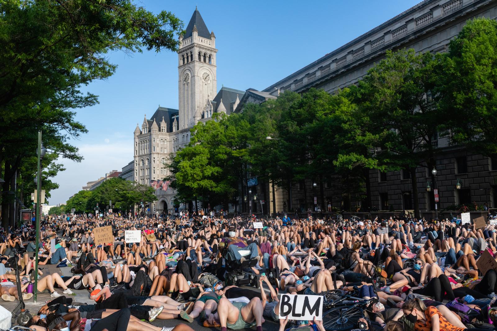 Image of protesters lying down near Trump Hotel