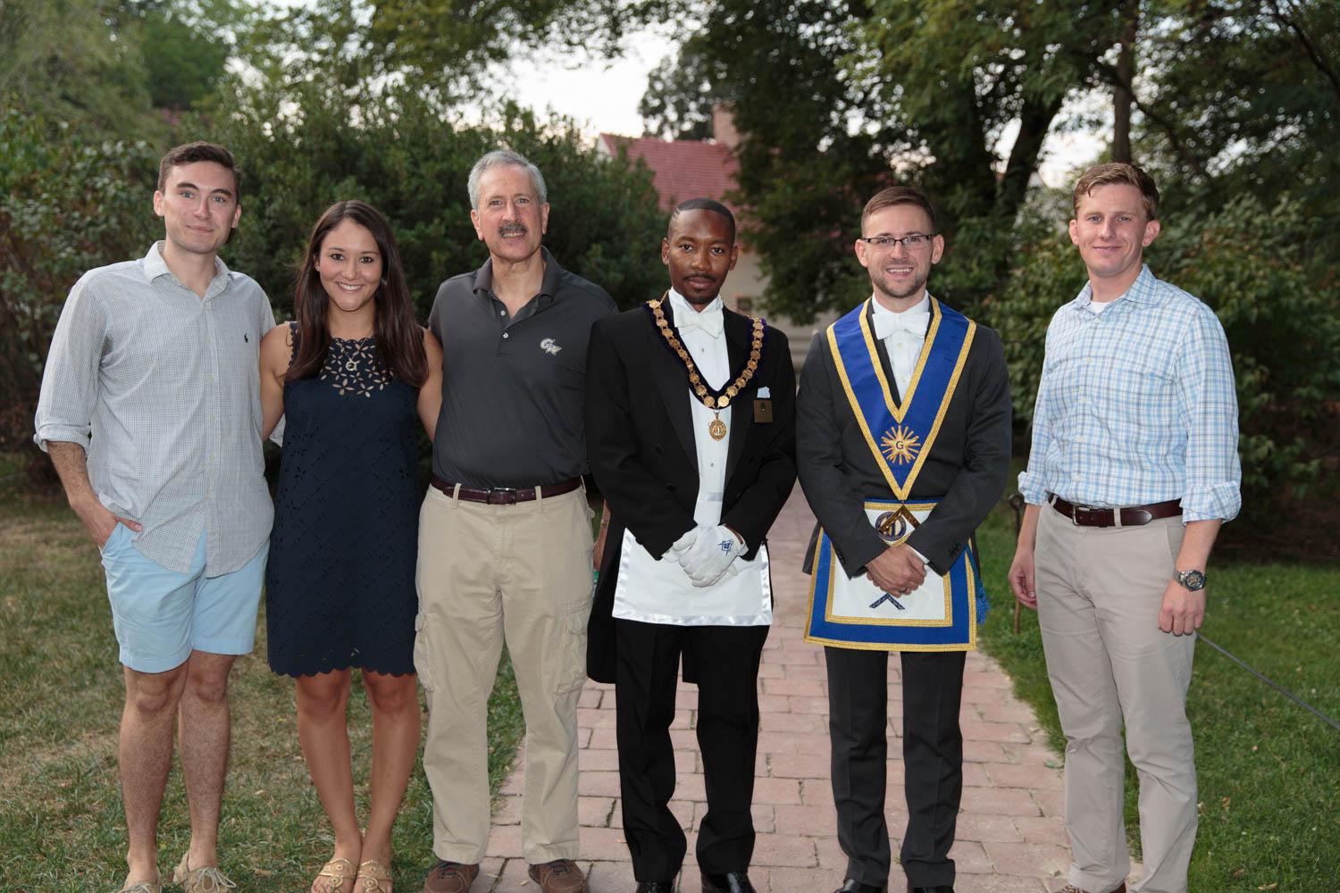 Chaplain Quardricos Driskell, M.A. ’12, and grad student Joshua Poole are pictured with SA EVP Casey Syron and SA President Andie Dowd, Provost Steven Lerman and Jamie Bosket, M.A. ’08.