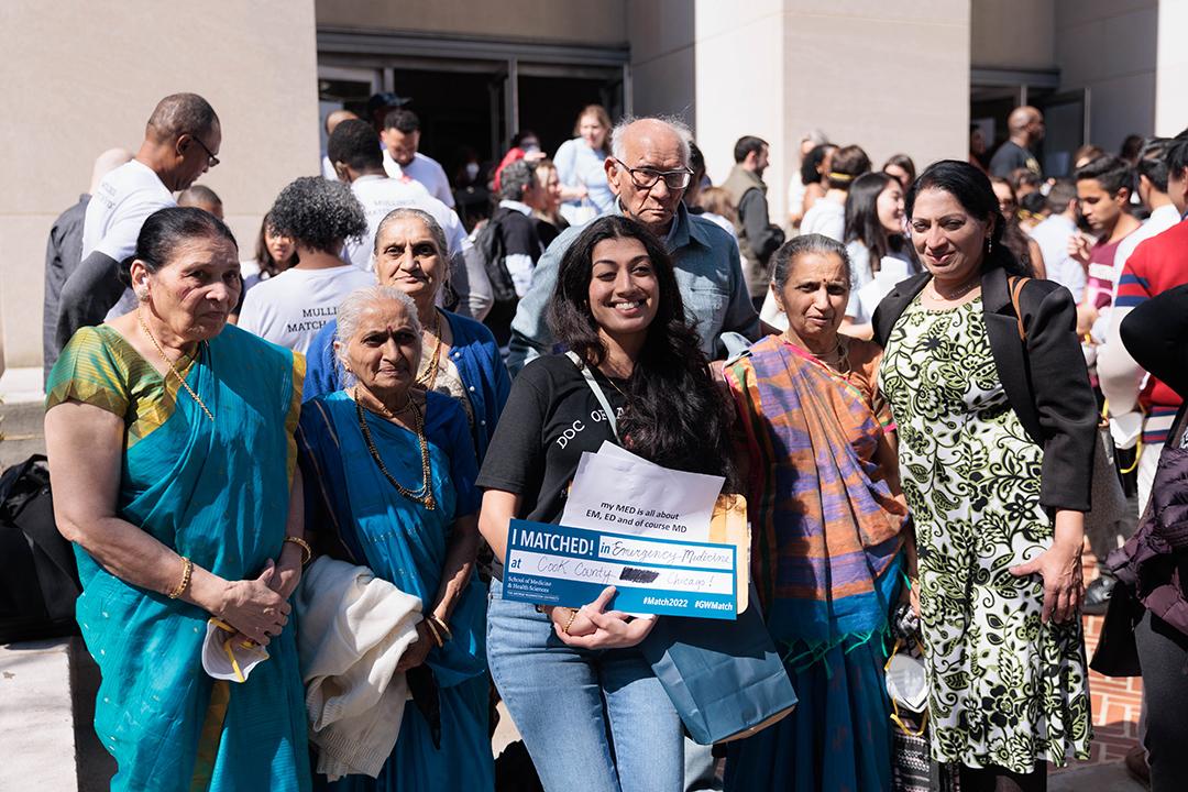 Match Day, family posing for photos