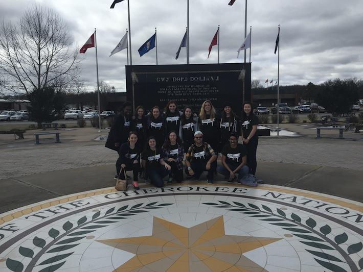 Students at the Cherokee Veterans' Memorial, which commemorates Cherokee soldiers who fought and died in American wars. (Photo c