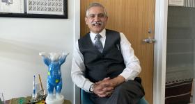 Milken Institute SPH Professor and Senior Associate Dean for Research Adnan Hyder, this year's WHS international president, with the summit's mascot, the World Health Summit Bear. (Adnan Hyder)