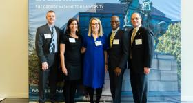 Dean Lynn R. Goldman is flanked by four alumni awardees: Christopher Jones and Keri Apostle are at left, and Ricky D. Allen and Steve Friedman are at right