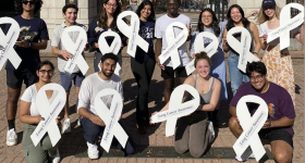 Shreya Papneja and a group of GW student volunteers built and painted white ribbons of plywood, which were signed by community members and distributed to lung cancer patients and survivors
