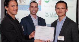 (Left to right) TCO Senior Licensing Manager of Physical Sciences Michael Harpen and TCO Executive Director Brian Coblitz present certificate to GW Engineering's Xitong Liu. 