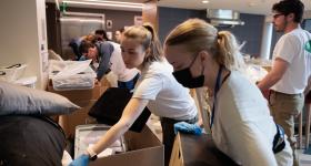 Student volunteers sort through donated goods for reuse during Green Move-Out.