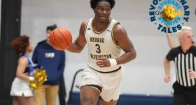 Darren Buchanan Jr. dribbling up and down the court.