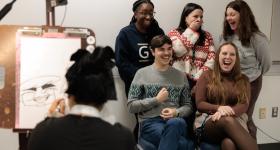 GW staff singing at the holiday celebration in 2024.