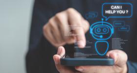 Person using smartphone with pop-up illustration of chatbot asking "Can I help you?"
