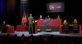 GW Law student William Schubert, center, addresses the judges on the bench. With Jordan Marcum, seated at left, he represented the petitioners before Chief Judge David J. Barron, Justice Ketanji Brown Jackson, and Judge Roopali H. Desai.