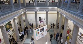 Party guests move through the Flagg Building Atrium seen from above
