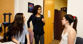 : Malathi Thothathiri (center with student researchers) 