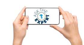 two hands hold an iPhone horizontally as if making a video