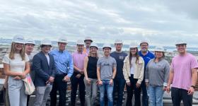 President and CEO of Paradigm Companies Stanley Sloter, GWSB Alumnus, fourth from left, leads students on a tour of a site his organization is developing. Sloter is an adjunct professor of finance with CRES.